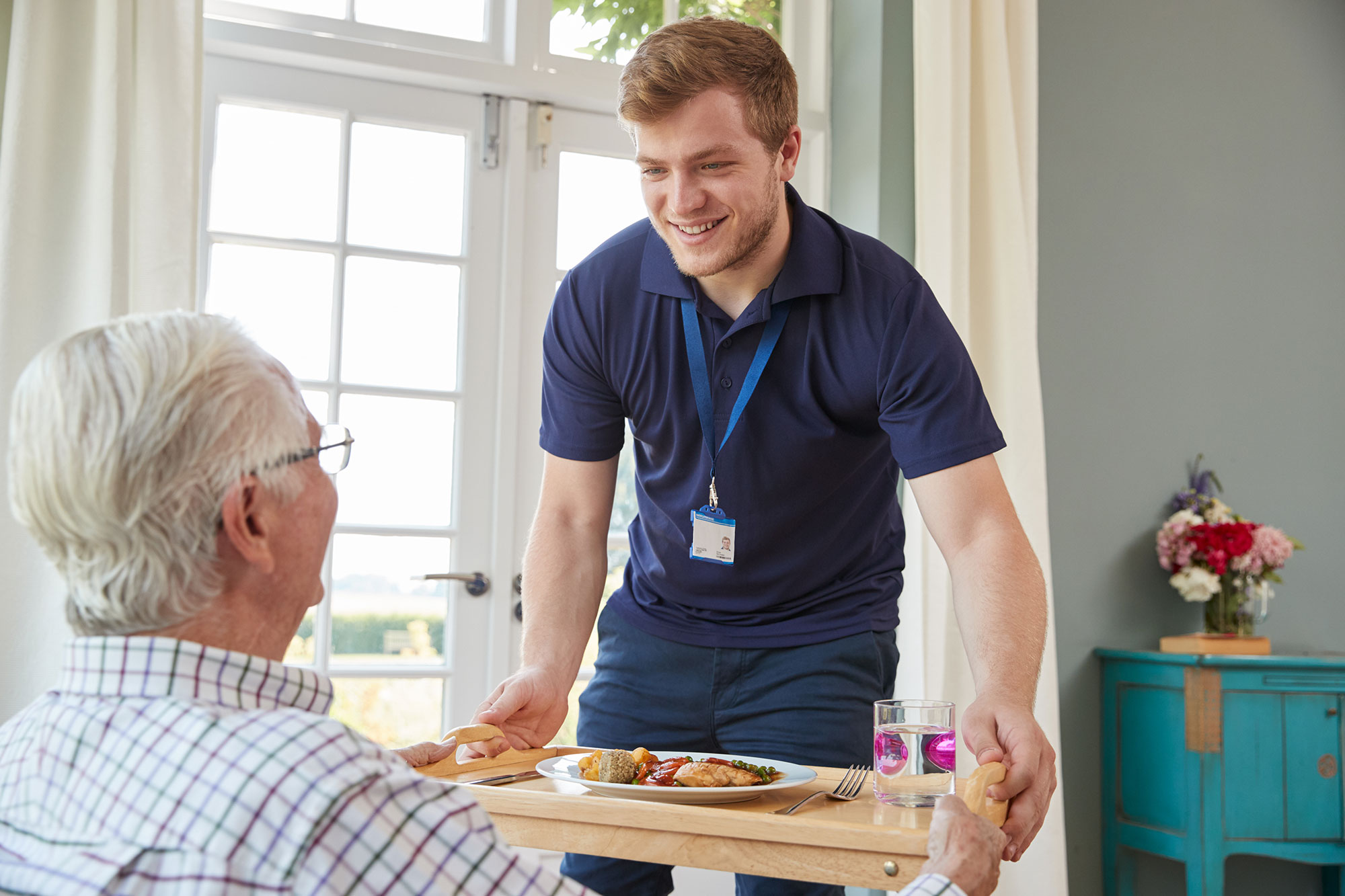 Care attendant talking to patient.